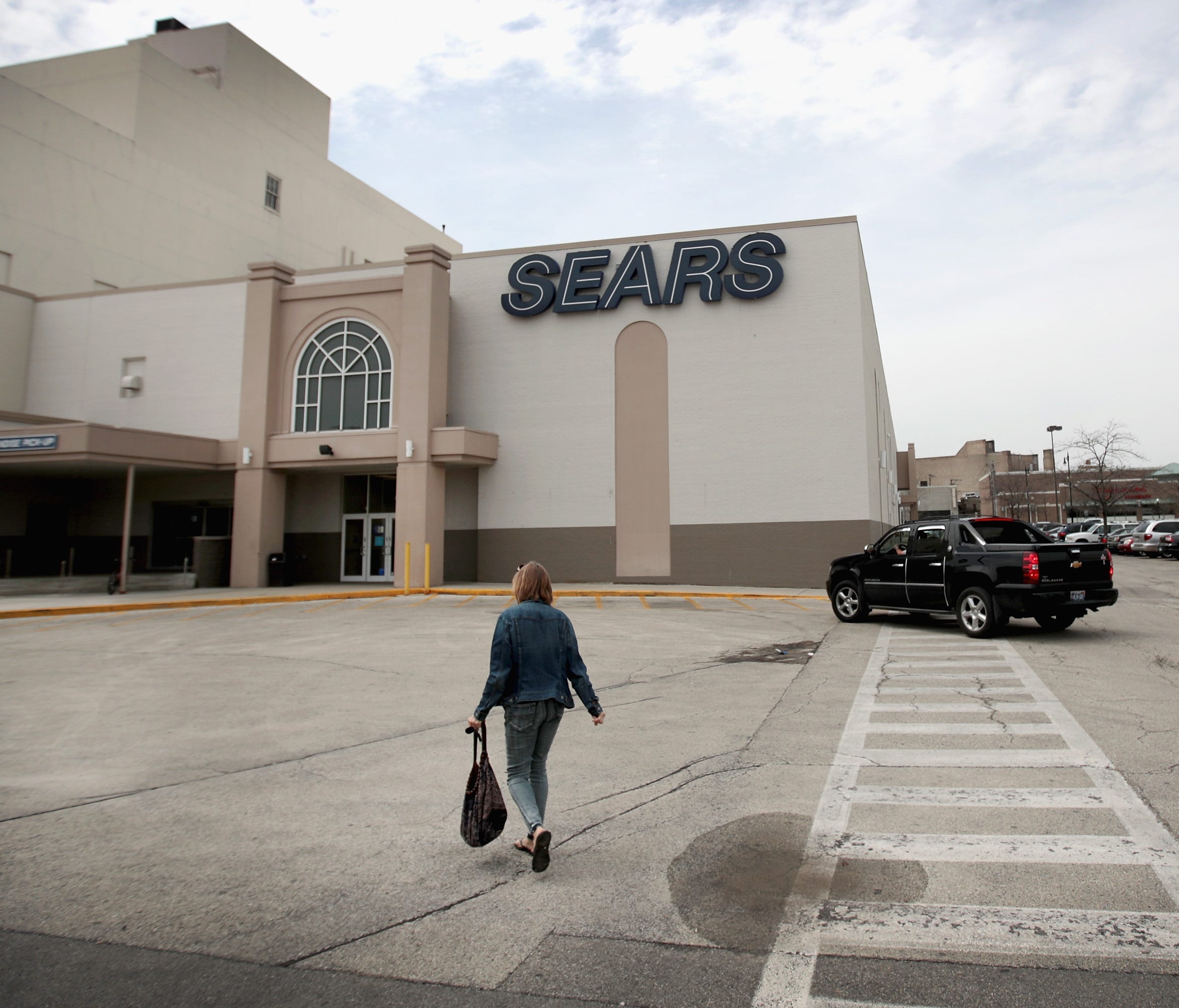 Customers shop at Chicago's last remaining Sears store May 3, 2018 in Chicago. The store, which opened in 1938, is scheduled to close in July. Sears opened its first retail store in Chicago in 1925.