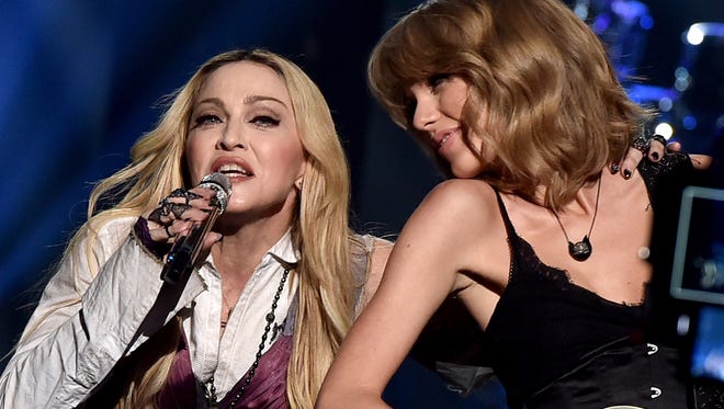 Madonna, left, and Taylor Swift perform 'Ghost Town' onstage during the iHeartRadio Music Awards in Los Angeles Sunday.