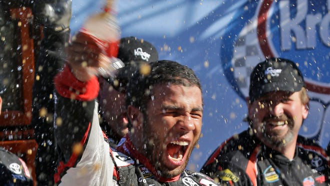 Darrell Wallace Jr. celebrates winning the NASCAR Camping World Truck Series race at Martinsville Speedway.