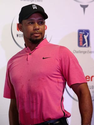 Tiger Woods stands up after speaking at a press conference ahead of the Hero World Challenge at Albany, The Bahamas, on Nov. 29, 2016 in Nassau, Bahamas.