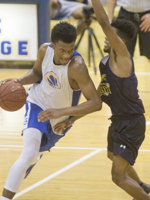 Hillcrest Prep's Marvin Bagley III drives into the lane during an exhibition game against Phoenix Community College at Phoenix Community College in Phoenix, AZ  on October 8, 2015.