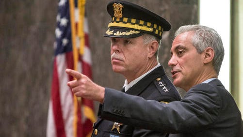 FILE - In this Oct. 6, 2015 file photo, Chicago Police Supt. Garry McCarthy and Mayor Rahm Emanuel speak in the City Council chambers in Chicago. This week marks the one-year anniversary of the release of the video showing Chicago Police Department officer Jason Van Dyke, a white police officer, shooting Laquan McDonald, a black teen, 16 times in all, as he lay mortally wounded. The video turned McDonald into one of the most significant figures in the story of race and justice playing out in Chicago and across the country, though one whose lasting impact remains in doubt because of the city’s uneven response and the uncertain impact of Donald Trump’s election as president. (Rich Hein/Chicago Sun-Times via AP)