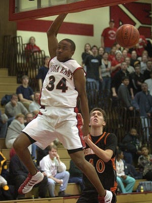 Wauwatosa East's Jerry Smith slams one home in 2003.
