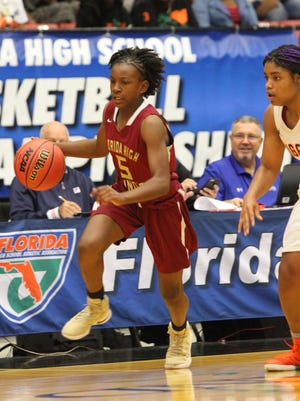 Florida High seventh-grader Tonie Morgan dribbles up the court during Saturday’s 5A state championship game.