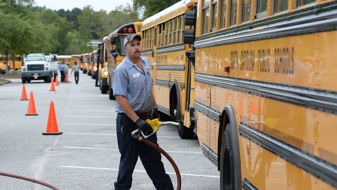 Greenville County Schools buses are fueled up and checked after arriving at the North Charleston Coliseum in preparation evacuations for Hurricane Matthew.