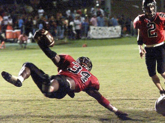 NFC running back Ernie Sims flips towards the endzone in the first half of a game in 2001.