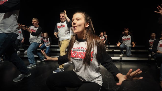 Courtney Neace, center, found a family and a "second mom" with the Austin High School’s Dimensions show choir. She lost her real mother to complications from drug addiction,which is widespread in the Austin, Indiana area.