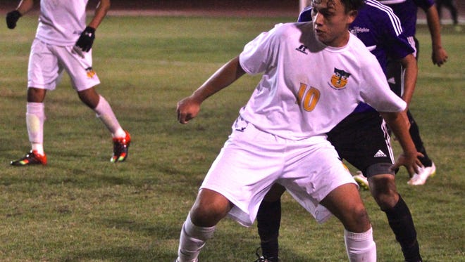 Arabs' Carlos Moreno (10) attempts to keep possession of the ball during a home match with the Knights on Tuesday.