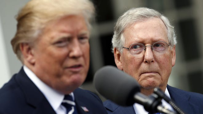 President Donald Trump speaks with Senate Majority Leader Mitch McConnell of Ky., in the Rose Garden after their meeting at the White House, Monday, Oct. 16, 2017, in Washington. (AP Photo/Alex Brandon)