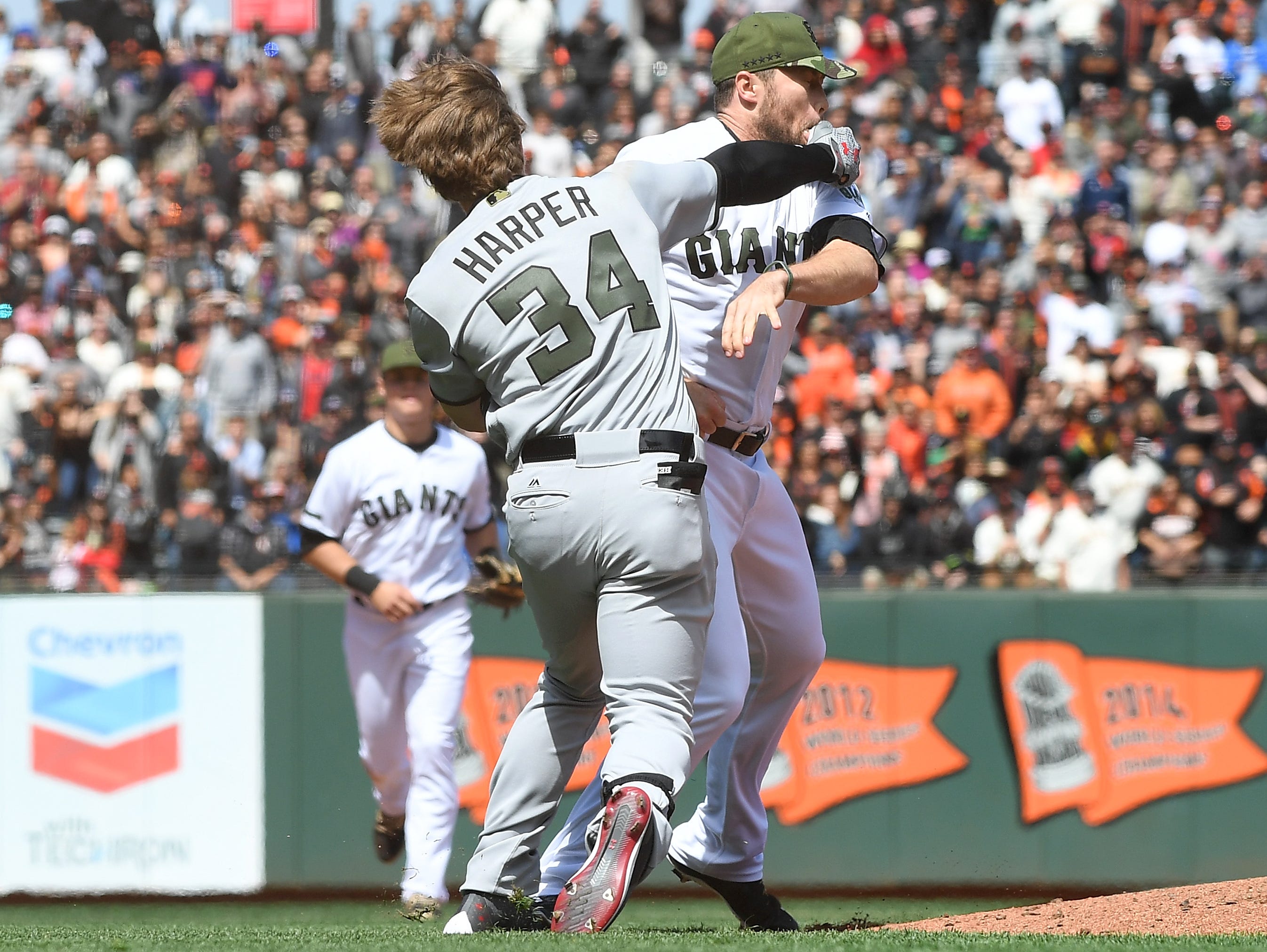 Bryce Harper and Hunter Strickland exchange blows on the mound.