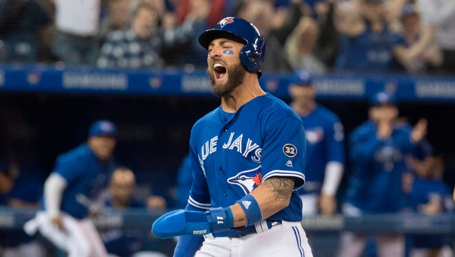 Blue Jays' Kevin Pillar celebrates after stealing home in the eighth inning.