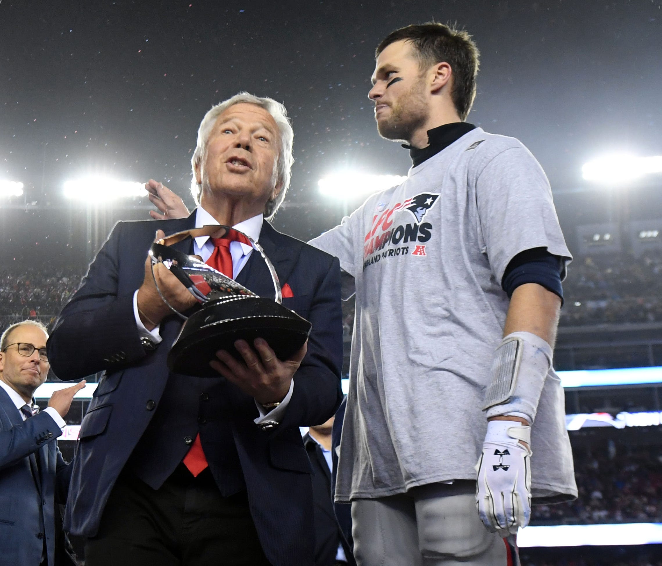 New England Patriots owner Robert Kraft and quarterback Tom Brady (12) with the Lamar Hunt Trophy after beating the Pittsburgh Steelers in the 2017 AFC Championship Game at Gillette Stadium.