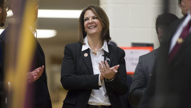 State Sen. Kelli Ward, seen here at a rally at Arizona State University for Sen. Rand Paul, was at a Tempe event where the founder of the Oath Keepers group called for Sen. John McCain to be tried for treason and executed by hanging.