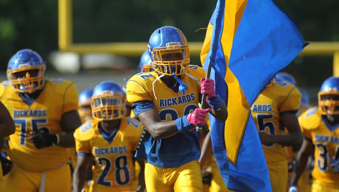 Rickards senior Tylen Buckner leads his team onto the field during the team’s spring game. The Raiders face Leon at Gene Cox Stadium this week.