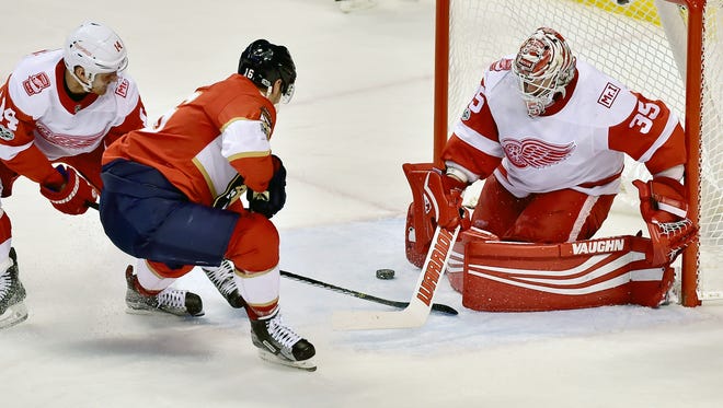 Panthers center Aleksander Barkov takes a shot against Red Wings goalie Jimmy Howard during the second period of the Wings' 3-2 shoot-out win Saturday, Oct. 28, 2017, in Sunrise, Fla.