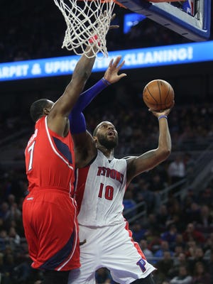 Pistons center Andre Drummond scores against Hawks center Elton Brand during fourth period action on Friday, January 9, 2015 at The Palace of Auburn Hills.