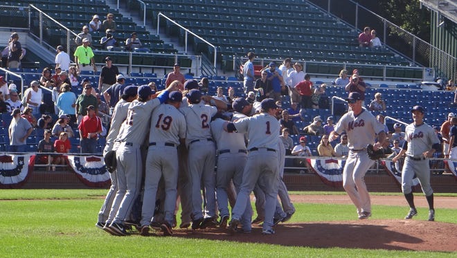 The Binghamton Mets swarm the mound after defeating the Portland Sea Dogs on Sunday.