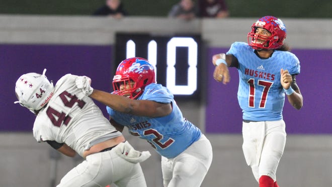 Hirschi quarterback Martez V'rana throws a pass during the Huskies 44-34 win over Brownwood Hirschi running back Daimarqua Foster runs away from the Brownwood defense for a touchdown during the Huskies 44-34 win in a Region I-4A bi-district playoff Friday at Abilene Christian University's Wildcat Stadium.