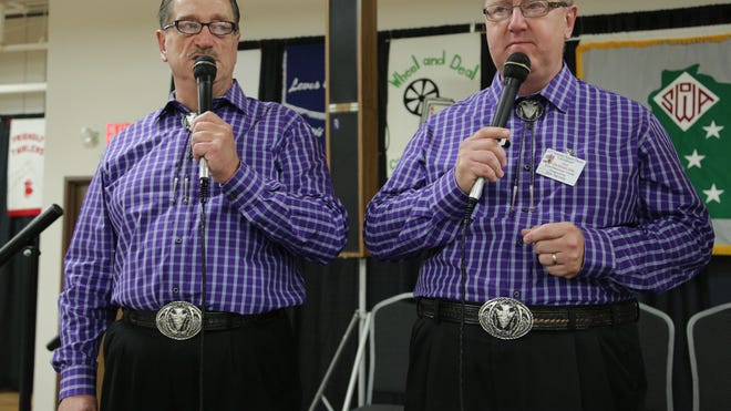 Iowa win brothers Doug, left, and Don Sprosty share calling duties at the 55th Wisconsin Square & Round Dance Convention at the Central Wisconsin Convention & Expo Center in Rothschild, Sunday, August 10.