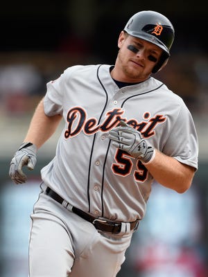 Tigers first baseman John Hicks rounds the bases after hitting a three-run home run against the Twins during the ninth inning April 23, 2017 in Minneapolis.