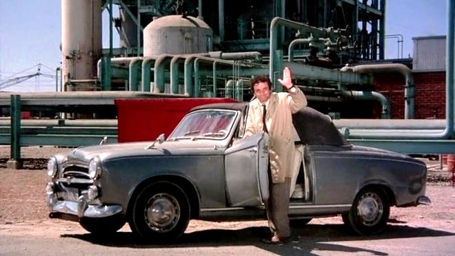Peter Falk poses with his "sidekick" 1959 Peugeot 403 Cabriolet (convertible) during a scene from the hit TV series "Columbo." Both NBC and ABC took part in its success during a 1971 to 2003 run.