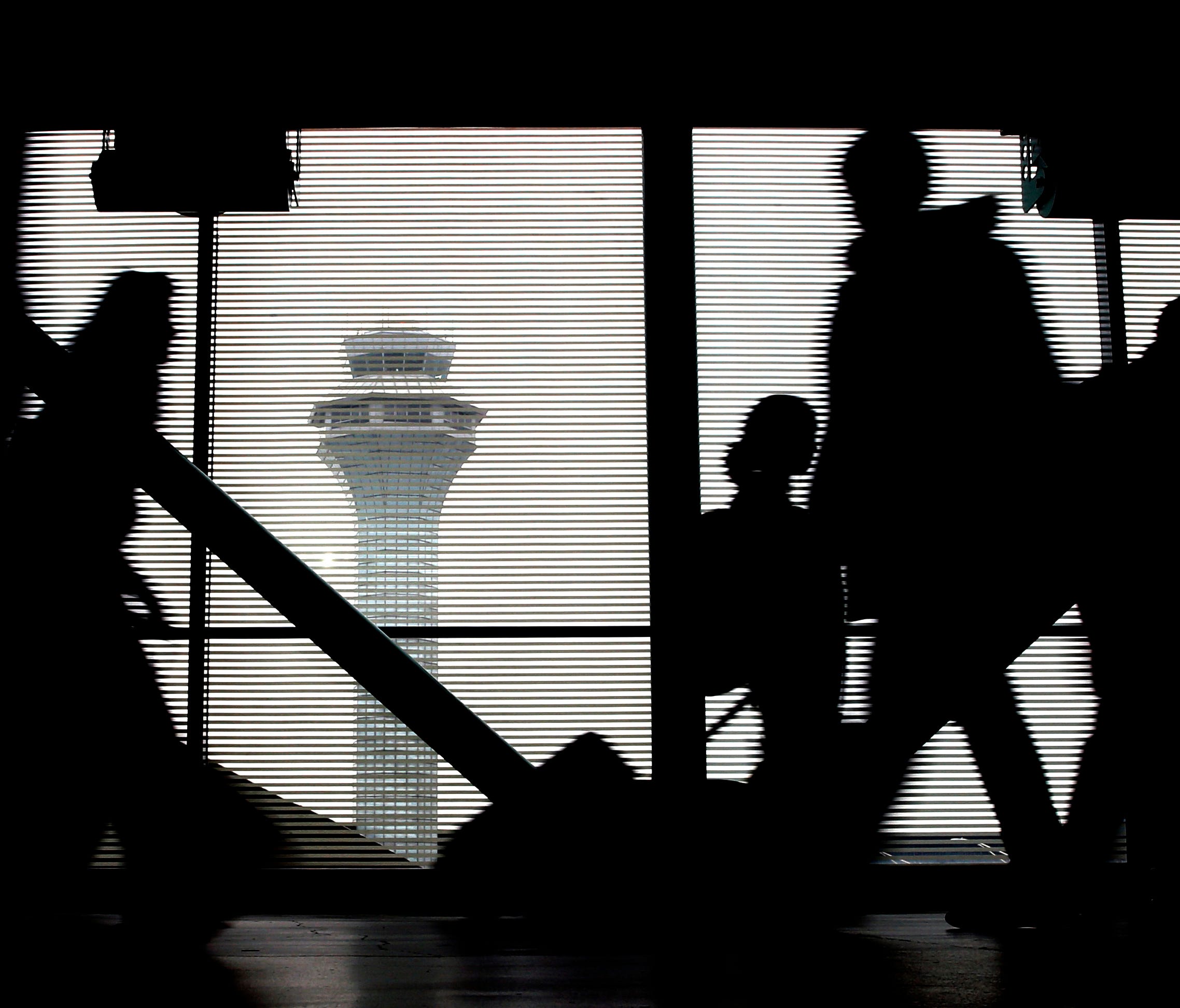 Travelers walk through Terminal 3 at Chicago's O'Hare International Airport on Nov. 23, 2016.