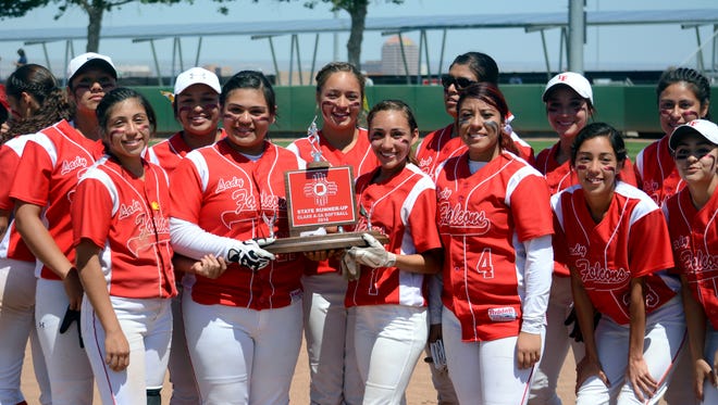 Members of the Loving softball hold the 3A state runner-up trophy Friday in Albuquerque. Despite losing 13-0 to Dexter in the finals, Loving made its 24th state championship appearance since 1989.