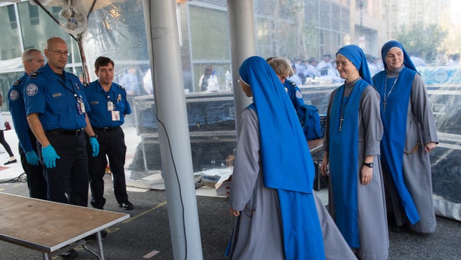 Nuns go through a security checkpoint in Philadelphia on Sept. 25, 2015, on the eve of the arrival of Pope Francis.