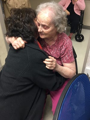 FLORIDA TODAY's Britt Kennerly hugs her mother, Helen Harney, who was diagnosed with dementia a few years ago.