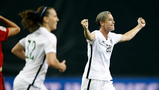 United States forward Abby Wambach (20) reacts after defeating Germany in the semifinals of the FIFA 2015 Women's World Cup at Olympic Stadium.
