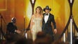 Tim McGraw, right, and Faith Hill walks on the stage