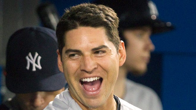 The Yankees' Jacoby Ellsbury smiles after hitting a two-run home run against the Toronto Blue Jays during the seventh inning of Friday night's game in Toronto.
