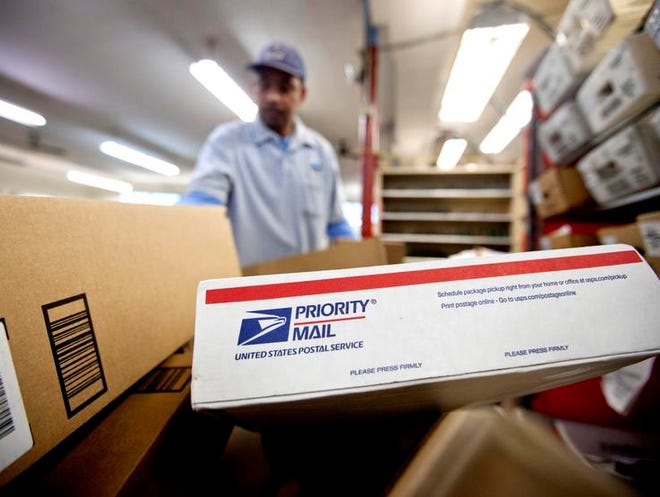 Packages await sorting at a U.S. Postal Service facility.