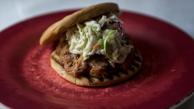 The boss pulled pork sandwich is one of the new Artmosphere Bistro menu items. Several more will be unveiled at a tasting party Saturday.