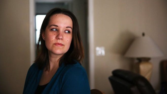 Nicole Lambros, 23, in her North Fort Myers home on June 4. Lambros was diagnosed with renal cell carcinoma and had surgery in March to remove part of her right kidney.