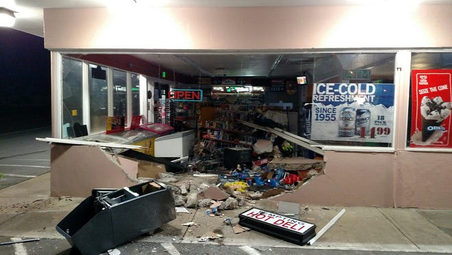 A truck crashed into a Brooks market, and its driver stole an ATM early Sunday morning.