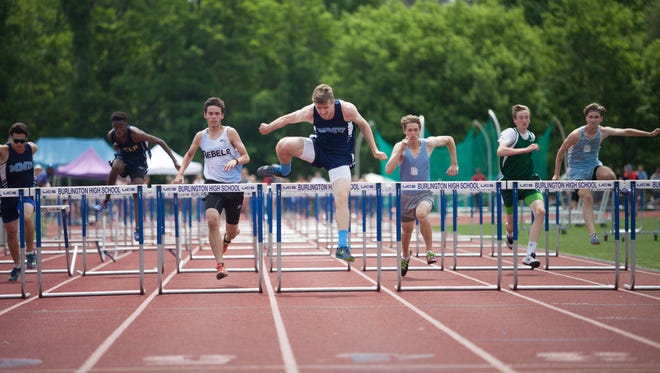 Mount Mansfield’s Jonathan Fisher clears the last hurdle to secure first in the boys 110 meters on Saturday at Burlington High School.