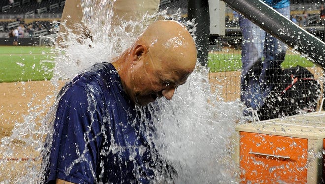 Cleveland Indians manager Terry Francona accepts the ALS Ice Bucket Challenge after a  game against the Minnesota Twins.