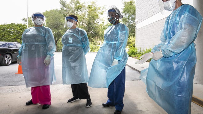 Nurses work at a COVID-19 testing site in Marion County on July 2, 2020.