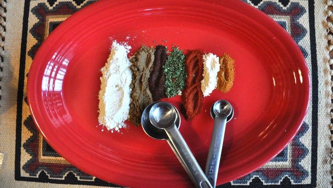 Pictured from left are onion powder, celery salt, chili powder, parsley flakes, sweet paprika, garlic powder and cayenne. Blended together and then added to salt, the mixture is a mosiac of balanced flavors good for seasoning chicken, steaks and vegetables. 