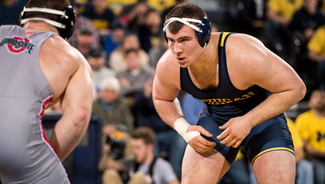 Adam Coon was a four-time state champion wrestler at Fowlerville and has been an All-American twice at the University of Michigan.