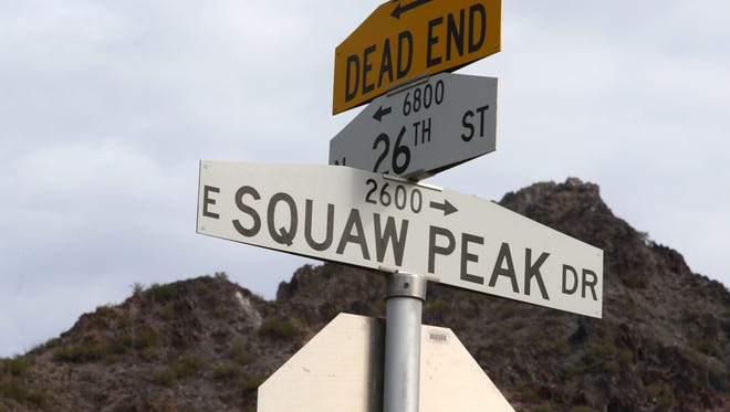 Squaw Peak Drive sign with Piestewa Peak (in the background) on Jan. 3, 2017 in Phoenix, Arizona.