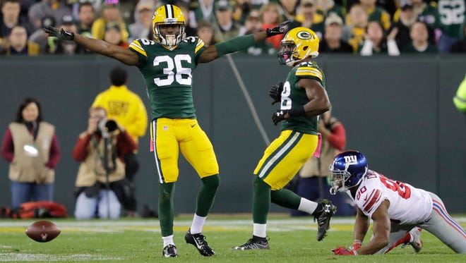 Green Bay Packers cornerback LaDarius Gunter celebrates breaking up a pass intended for New York Giants receiver Victor Cruz at Lambeau Field.