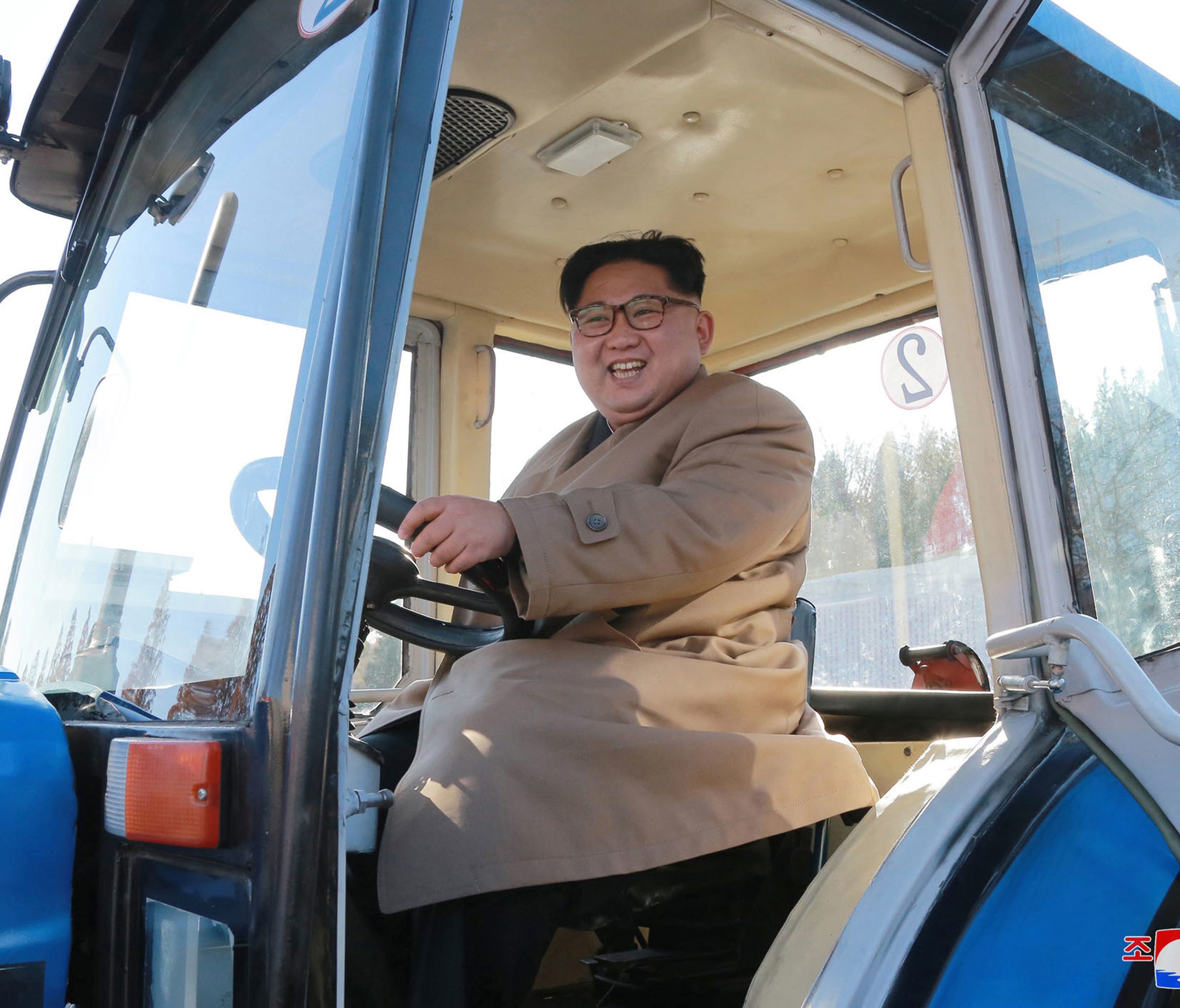 In this undated photo provided on Wednesday, Nov. 15, 2017, by the North Korean government, North Korean leader Kim Jong Un sits in a tractor at the Kumsong Tractor Factory, in Nampo, North Korea. Independent journalists were not given access to cove