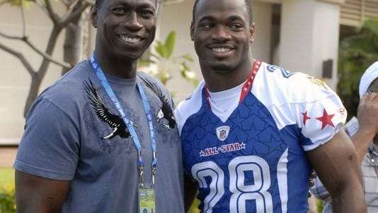 Adrian Peterson and his father, Nelson Peterson, in 2009.