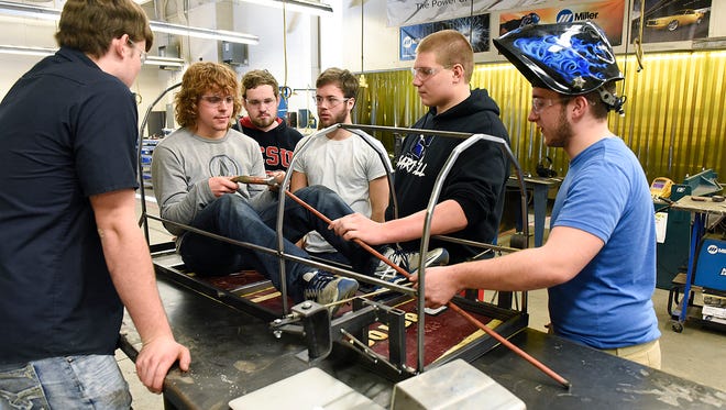 Sartell High School technology education students work on the steering for a Supermileage car Tuesday, Dec. 20, in Sartell. The technology education class will compete with their Supermileage car this spring at the Brainerd International Raceway.