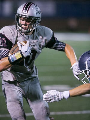 Hamilton's Brandon Krcilek had a great all-around game, catching touchdown passes of 15 and 69 yards in the first half, booming a 70-yard punt and intercepting Brian Lewerke's last, desperation pass in the final quarter of the win over Pinnacle.