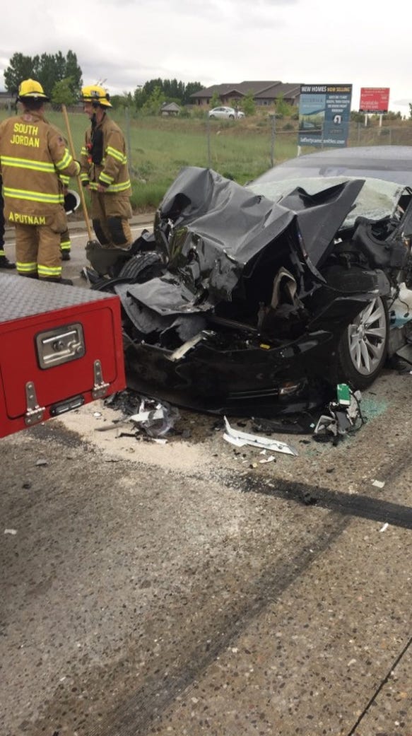 A Tesla Sedan with Semi-Autonomous Autopilot Function