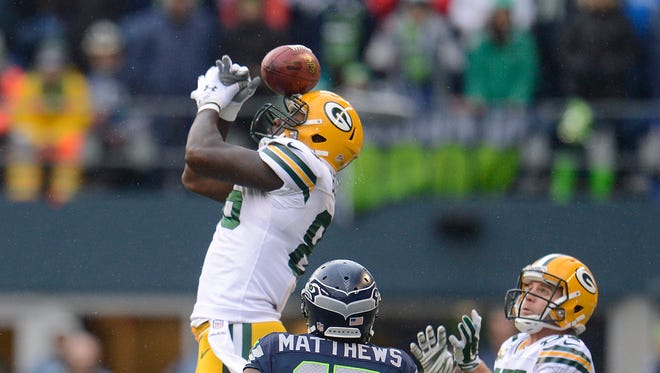 Green Bay Packers tight end Brandon Bostick bobbles an onside kick by the Seattle Seahawks during the NFC championship game in Seattle. The Seahawks recovered.