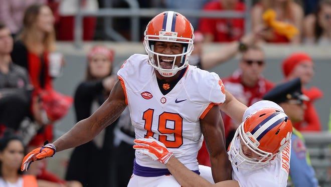 Clemson wide receiver Charone Peake (19) celebrates with wide receiver Hunter Renfrow (13) after catching a 42 yard TD against North Carolina State Saturday at North Carolina State's Carter Finley Stadium in Raleigh, N.C.